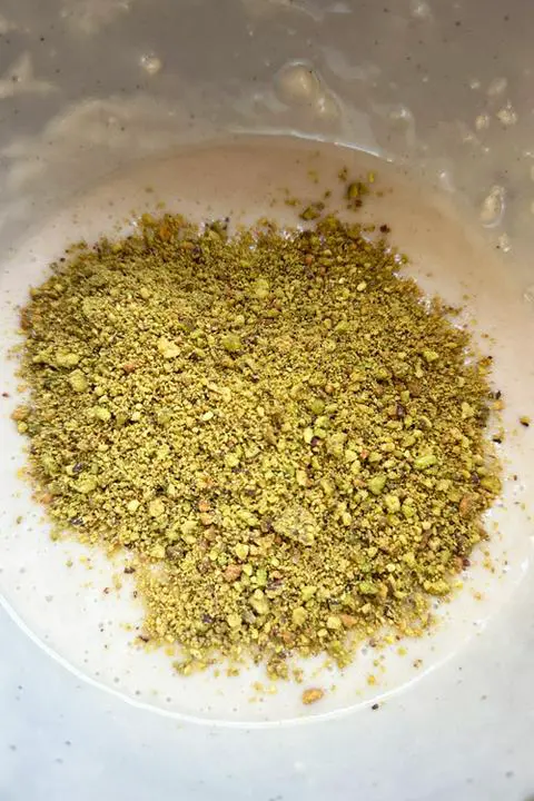 adding pistachios to half the batter
