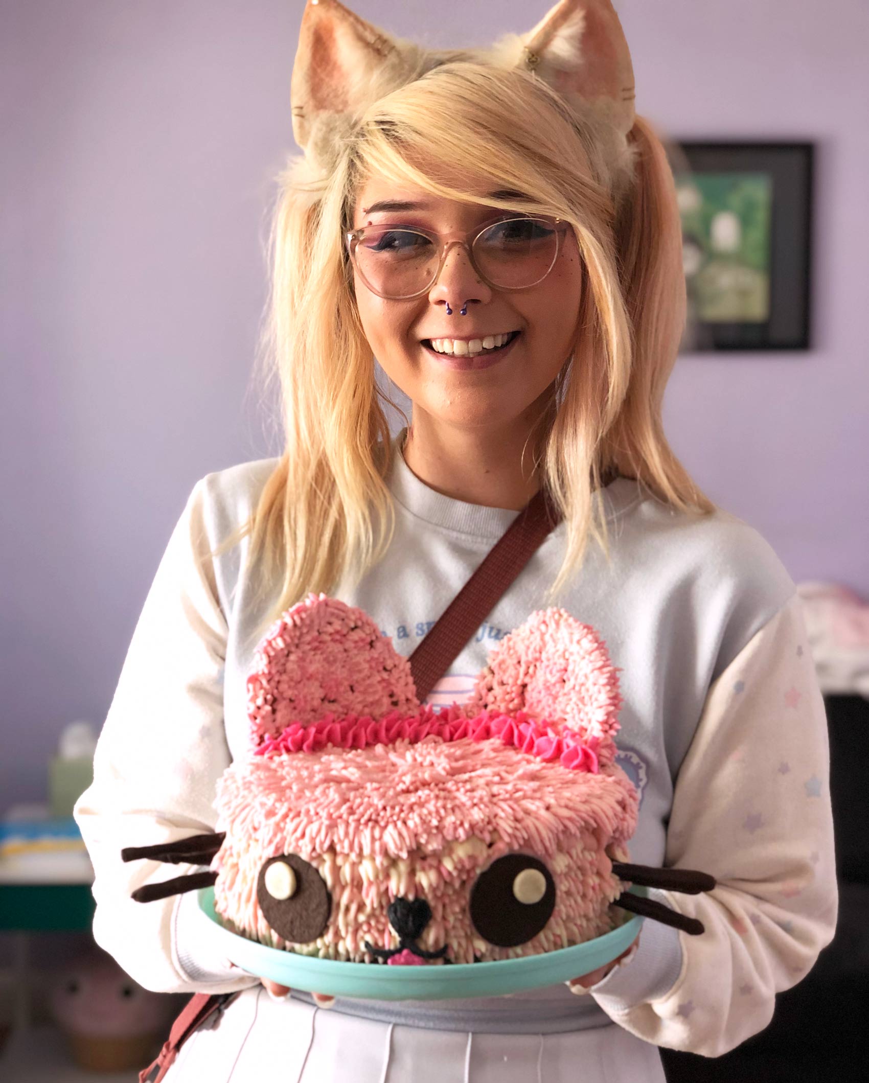 vegan puppy girl holding her vegan pumpkin spice puppy birthday cake