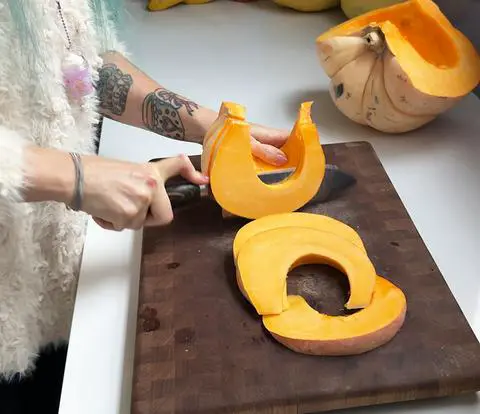 slicing the pumpkin into slices of the same thickness.