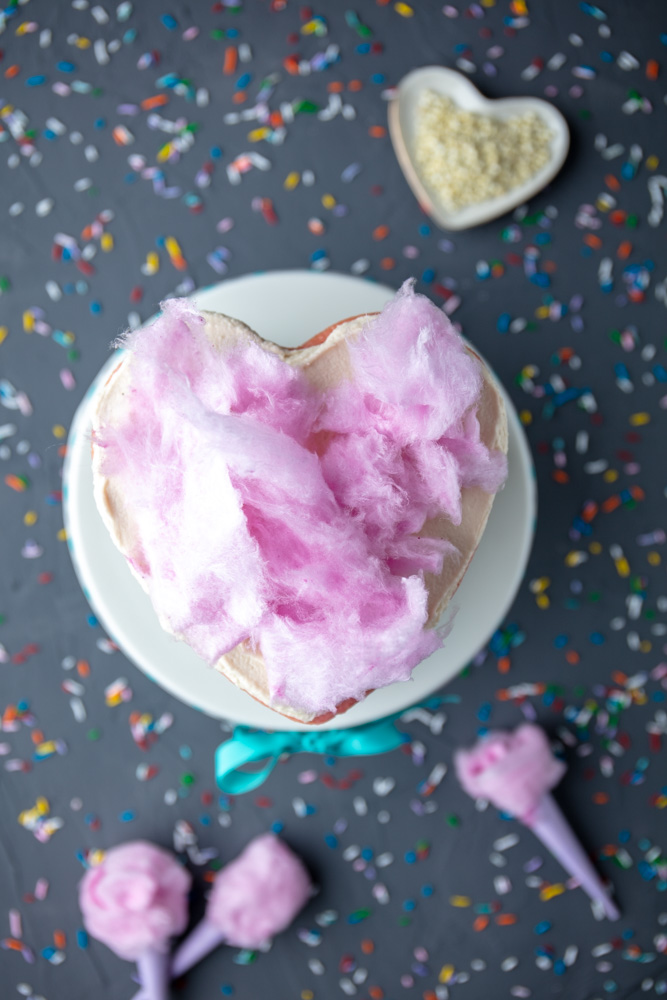 rainbow smash cake topped with vegan pink cotton candy