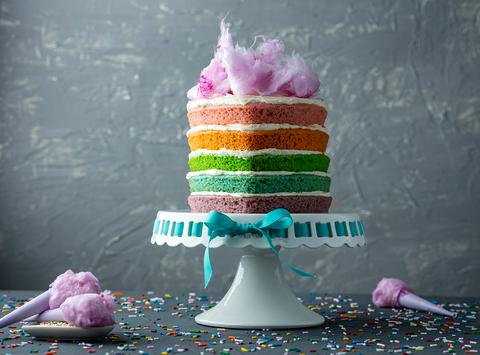 vegan heart-shaped mini rainbow cake topped with pink cotton candy