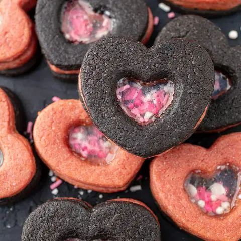 vegan pink and black heart shaker cookies with a glass window