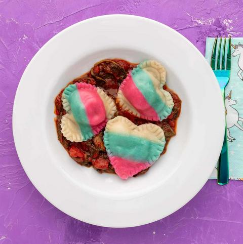 vegan heart shaped mushroom ravioli decorated to look like the trans flag