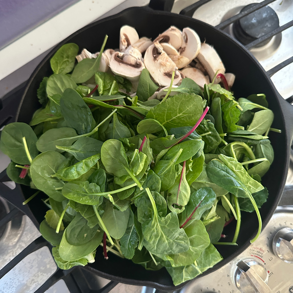 sautéing veggies for the spinach ravioli filling