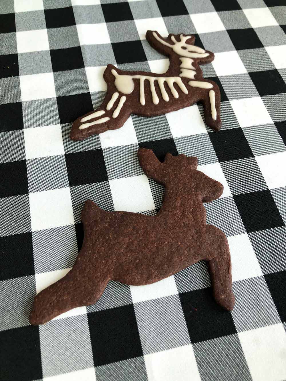 decorating vegan reindeer skeleton cookies