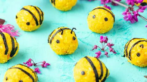 vegan egg salad rice balls decorated like bumble bees