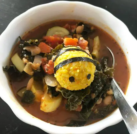 vegan korean rice ball in a bowl of soup