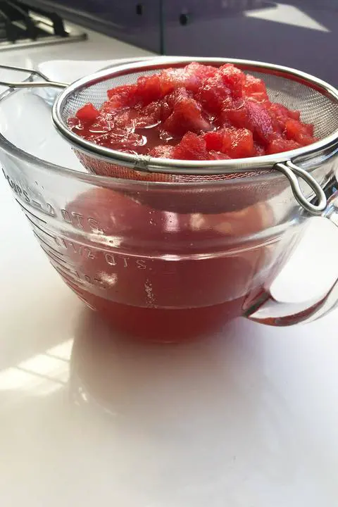 straining the vegan watermelon syrup