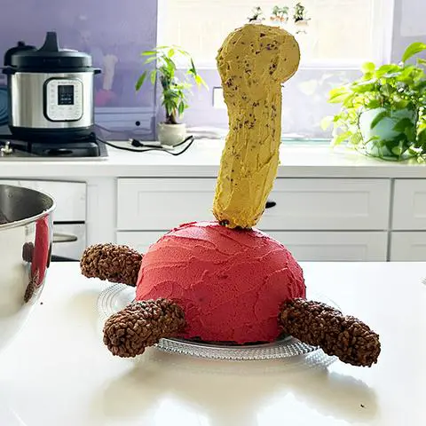 shuckle cake being assembled.