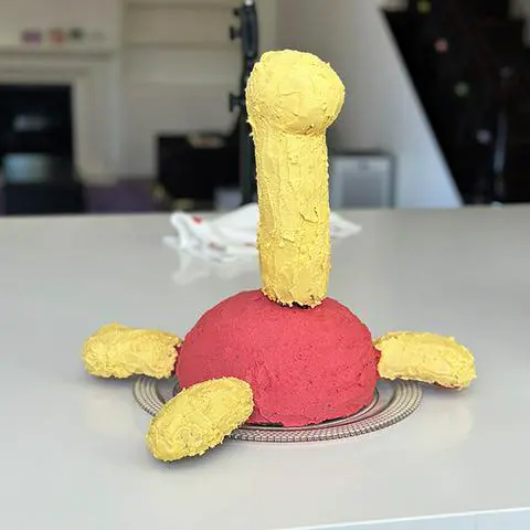 the shuckle cake with a complete coat of frosting.