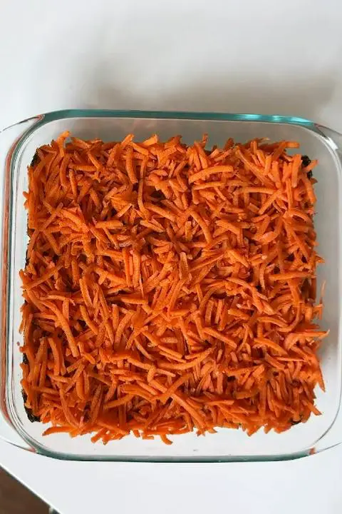 grated carrot layer.