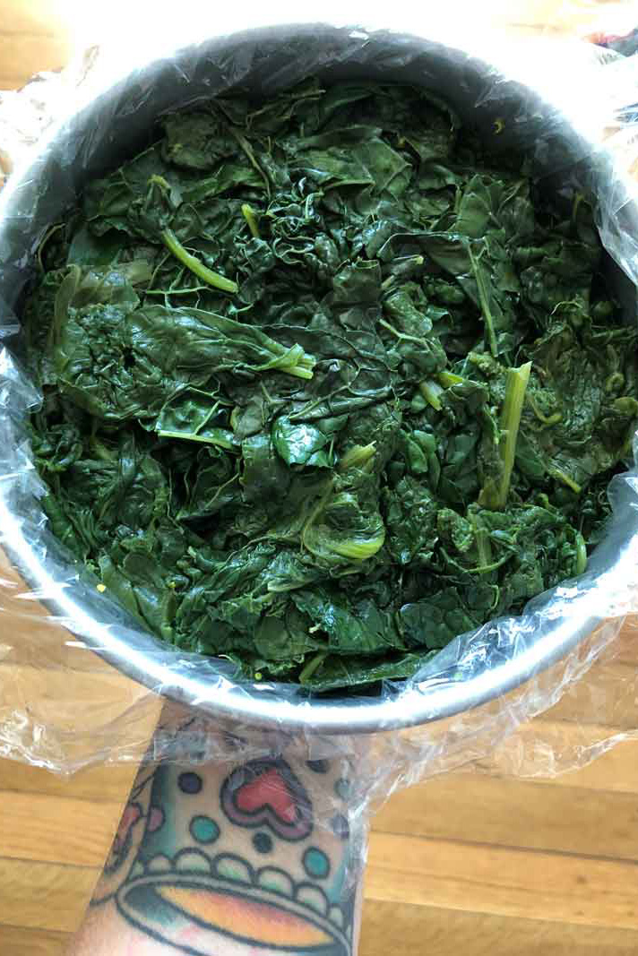 steamed greens in a cake pan
