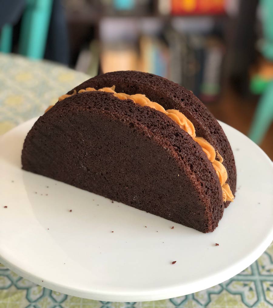 filling the chocolate cake with vegan peanut butter filling