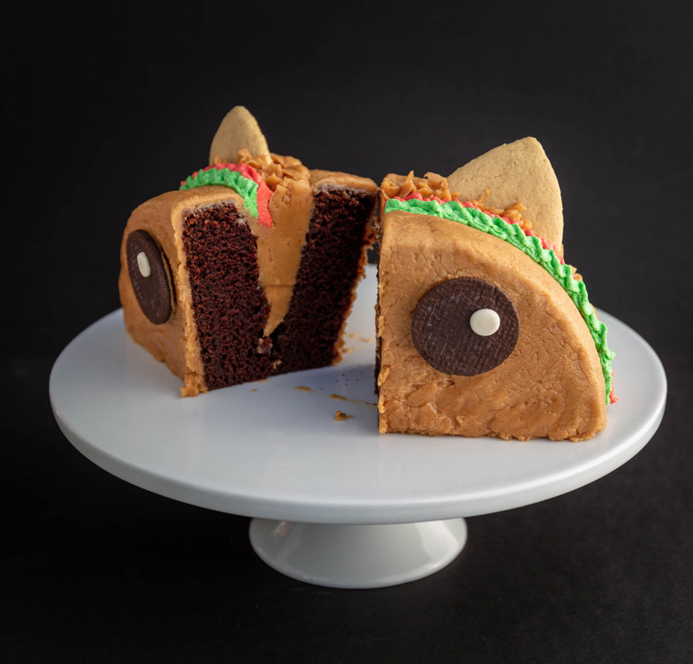 vegan Tacocat cake cut in half