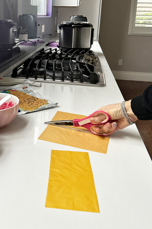 cutting soy wrappers for the temaki sushi cones