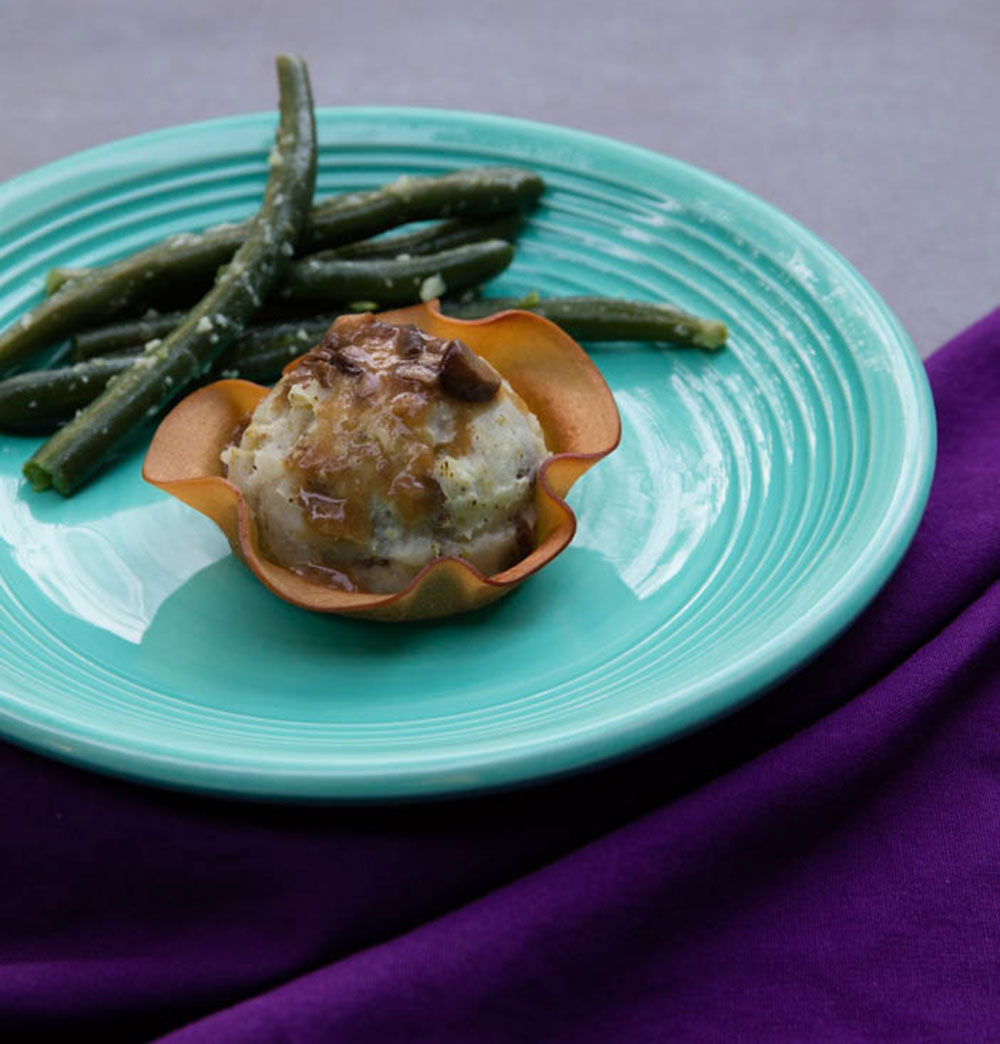 Vegan Mashed Potatoes and Gravy inside of a turkey deli slice baked to look like a flower