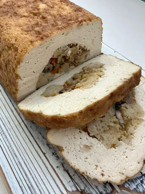 Vegan Thanksgiving Tofu Turkey sliced with stuffing inside