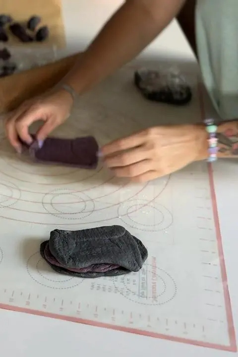 alternating layers of black and purple pasta dough