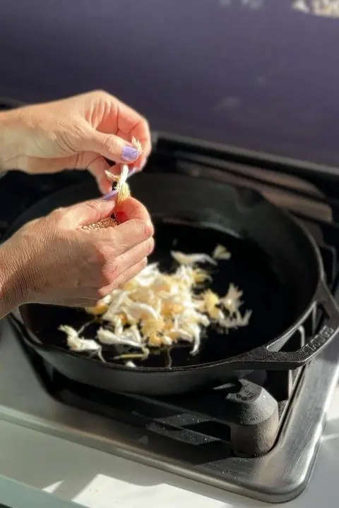 shredding the lion’s mane mushroom for the ravioli filling