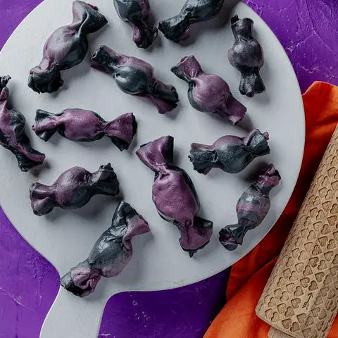 naturally colored black and purple vegan truffle ravioli candies