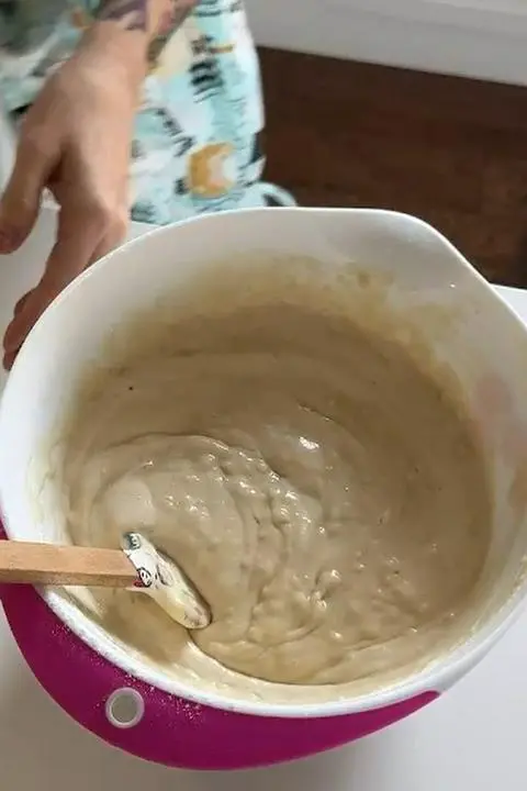 folding the vinegar into the cake batter