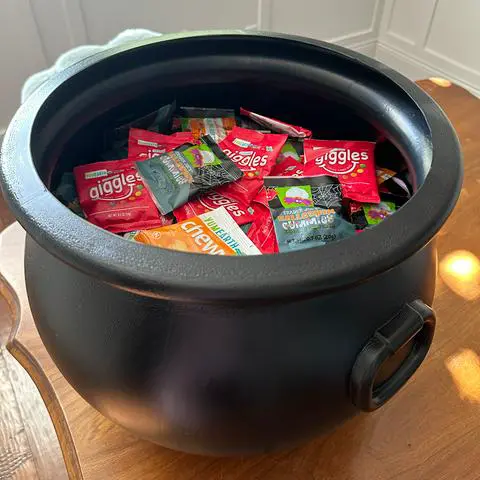 a variety of fun size vegan halloween candy in a cauldron